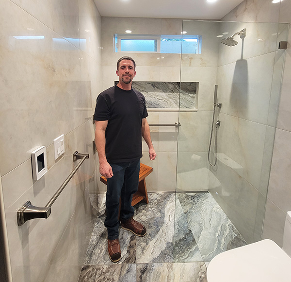 20250117 Wards' Tile Works Danny Ward standing in bathroom image 600x580